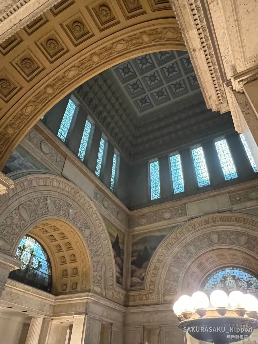 The Central Hall, with its arches, stained glass and painted murals