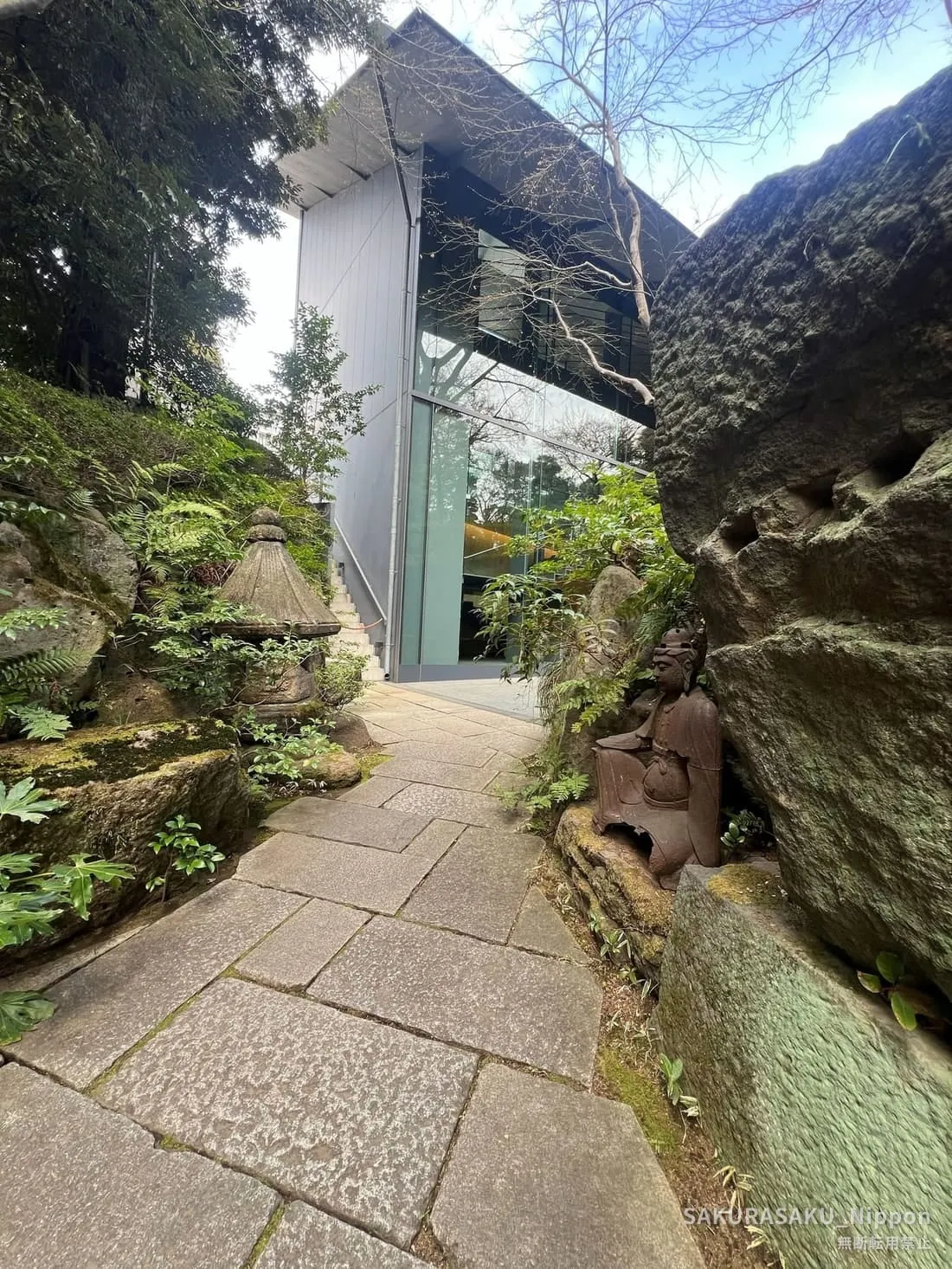 Stone path winding into the hillside garden of the Nezu Museum