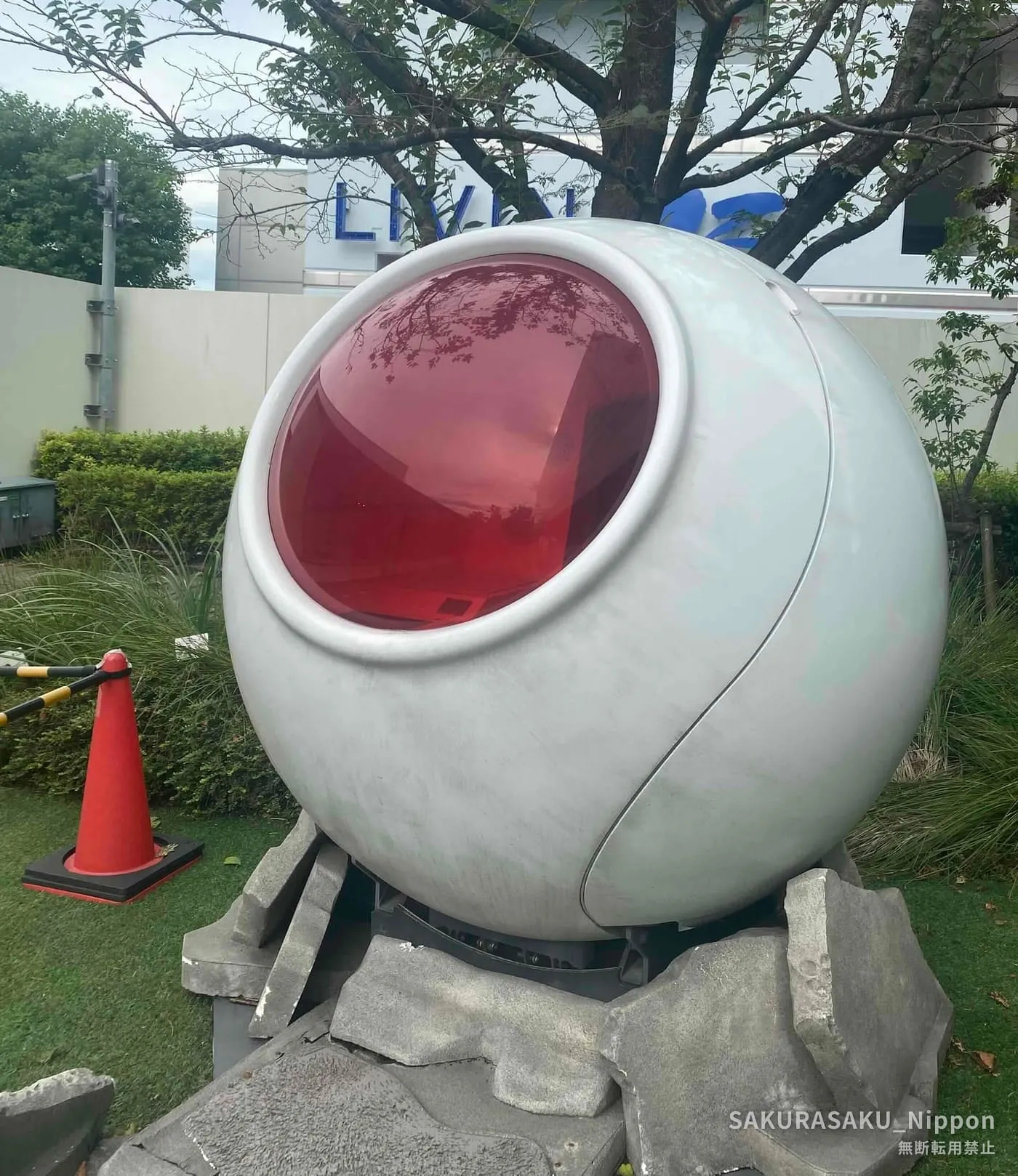 Saiyan space pod from Dragon Ball resting in the museum garden