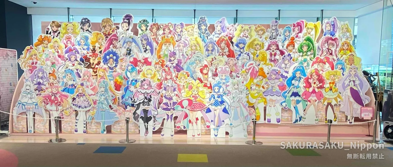 Cardboard cutout lineup of dozens of Precure characters