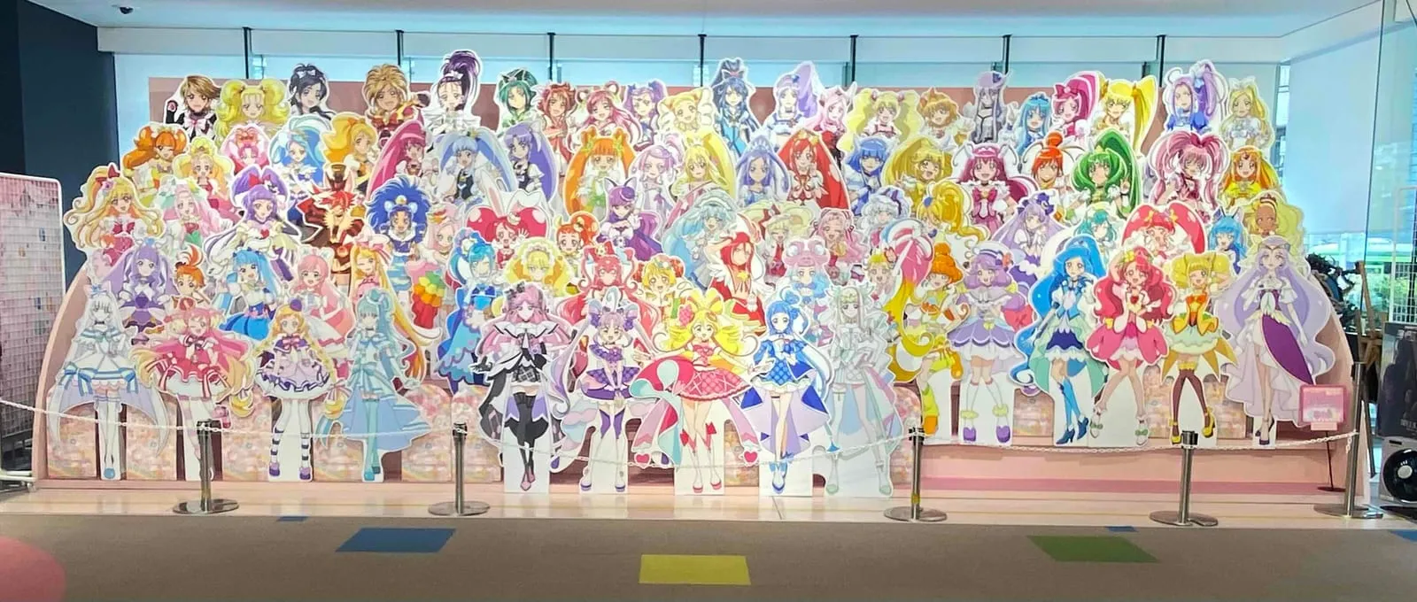 Cardboard cutout lineup of dozens of Precure characters