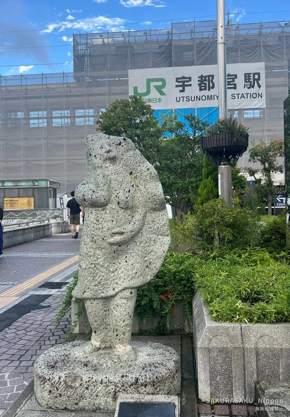 The gyoza statue outside Utsunomiya Station, carved from local Oya stone